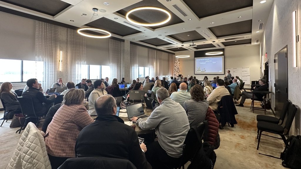 A full boardroom during a live Clustr AI training session